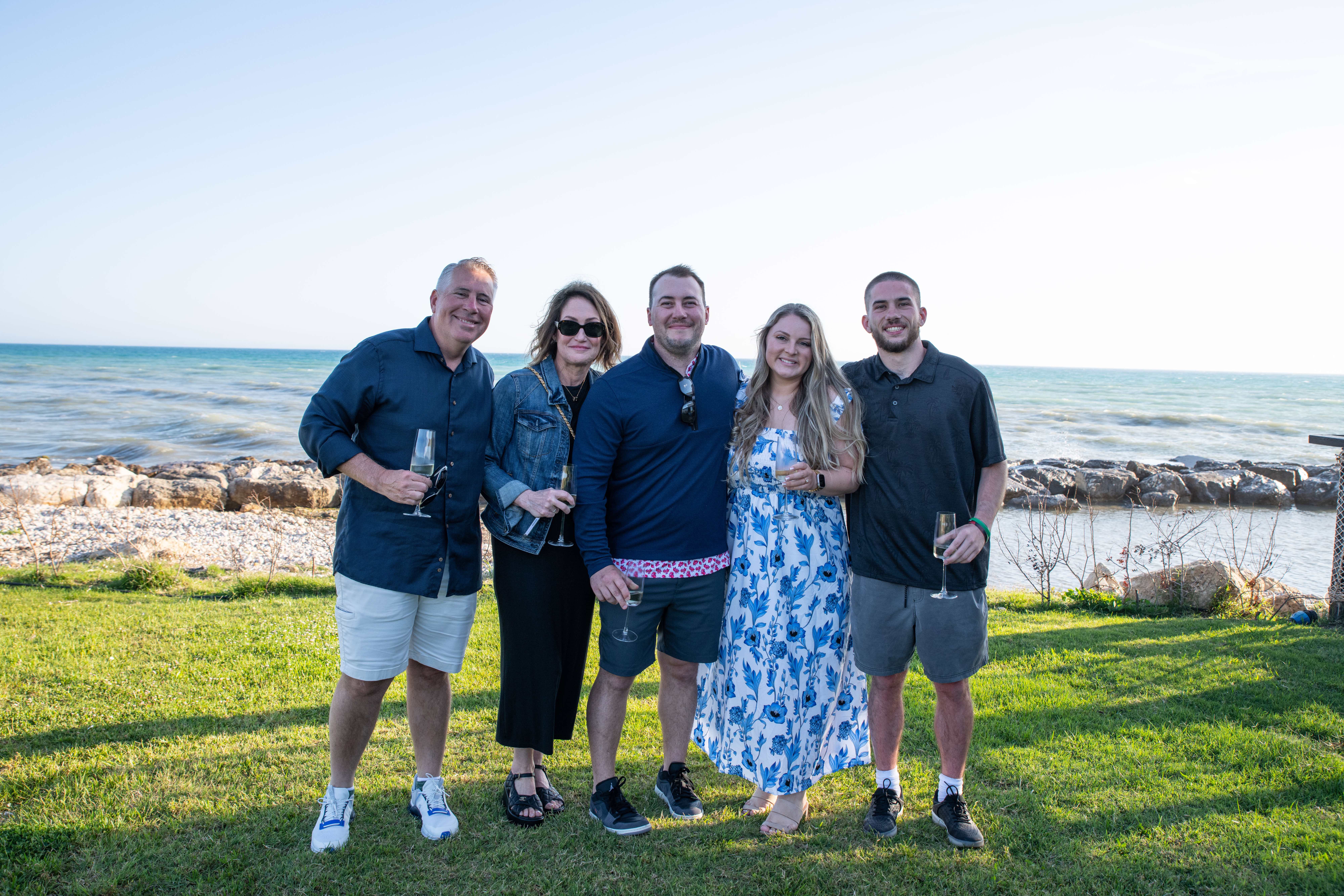 The McGoff family together by the lakeshore at golden hour